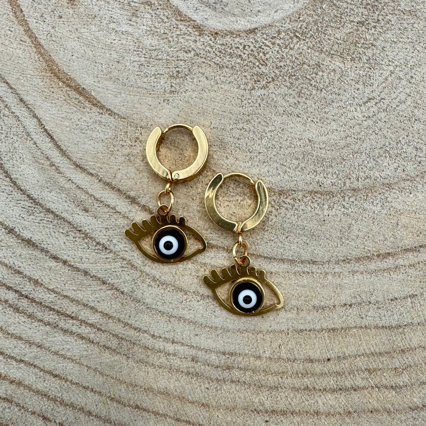 Brincos Dourados Olho Preto