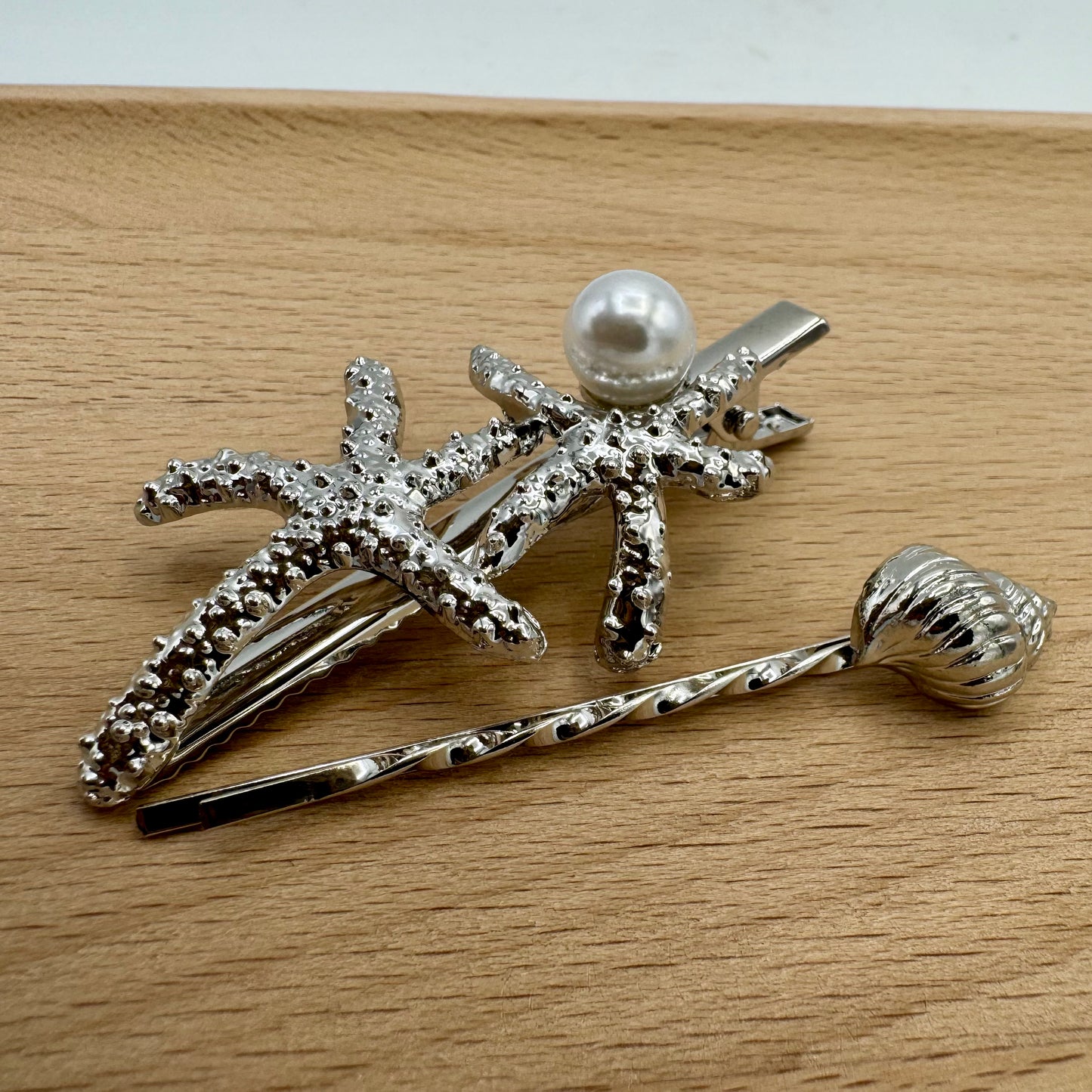 Gancho e Mola Cabelo Prateado Buzio e Estrelas do Mar