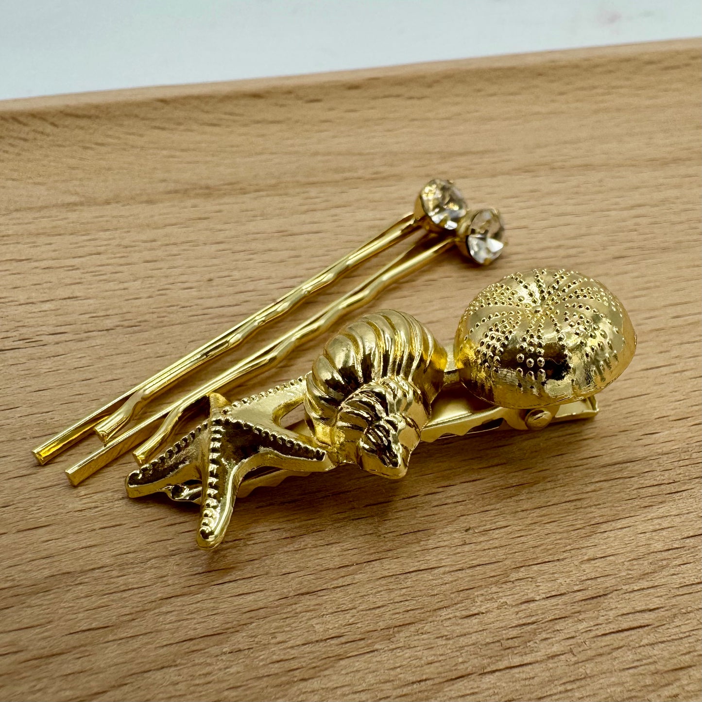 Gancho e Mola Cabelo Dourado Frutos do Mar e Brilhantes